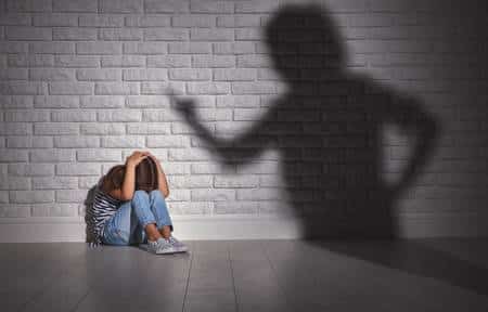 93931136-domestic-violence-angry-mother-scolds-frightened-daughter-sitting-on-floor-